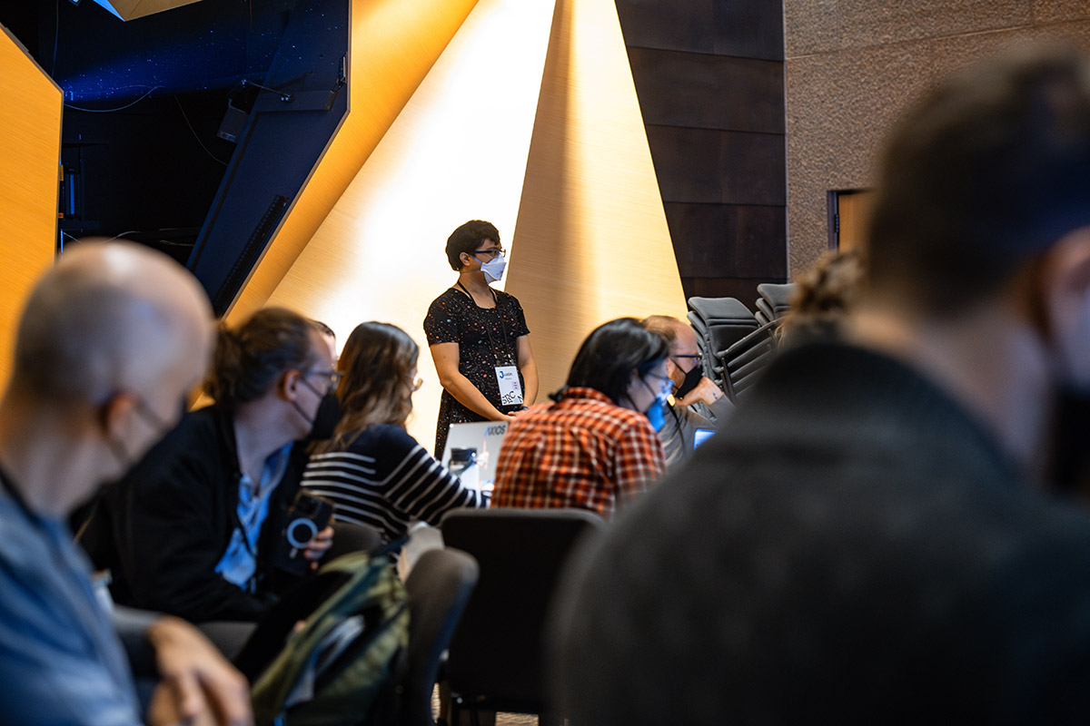 A facilitator listens to participant discussion during a session at SRCCON 2023.