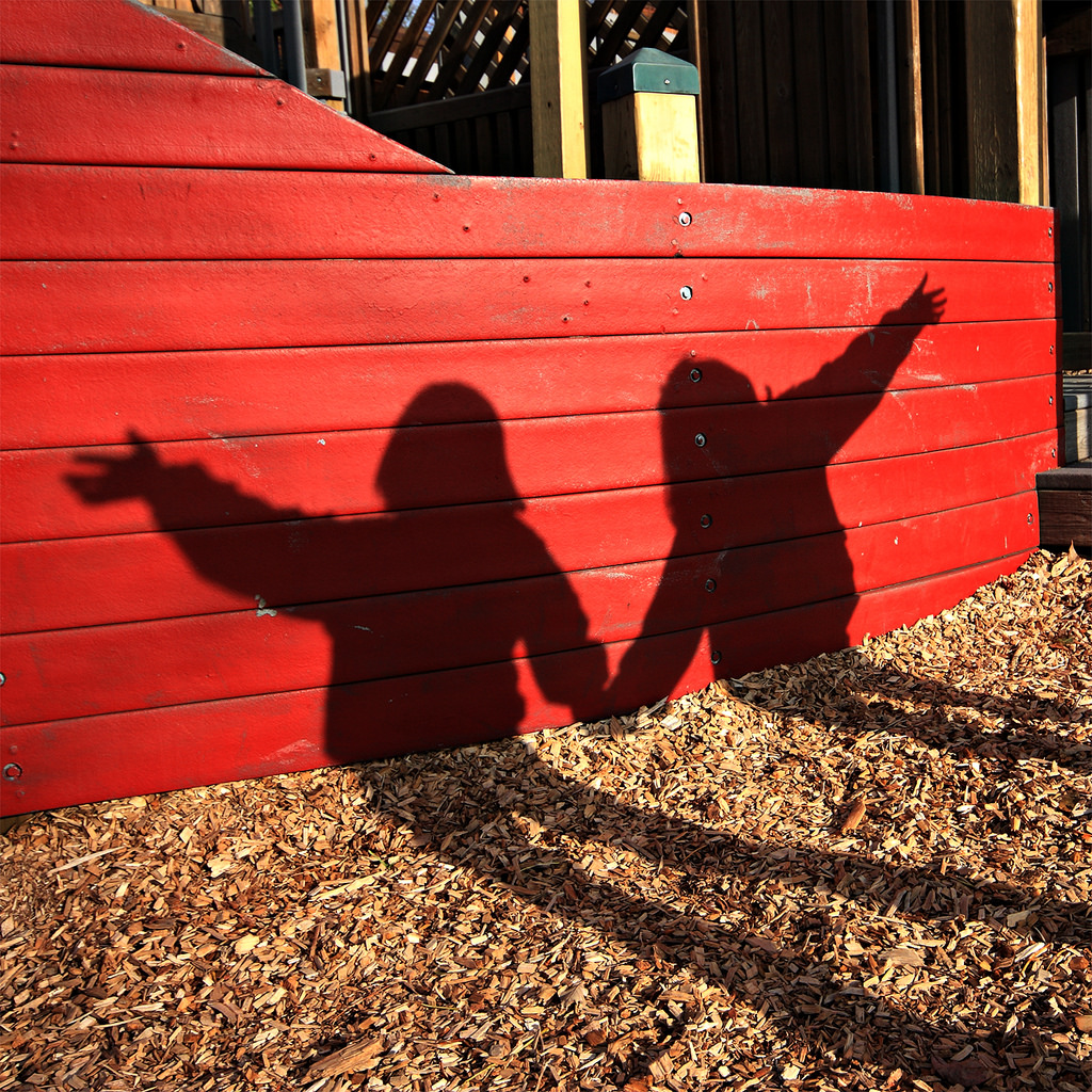 Shadows of kids playing outside in the sun